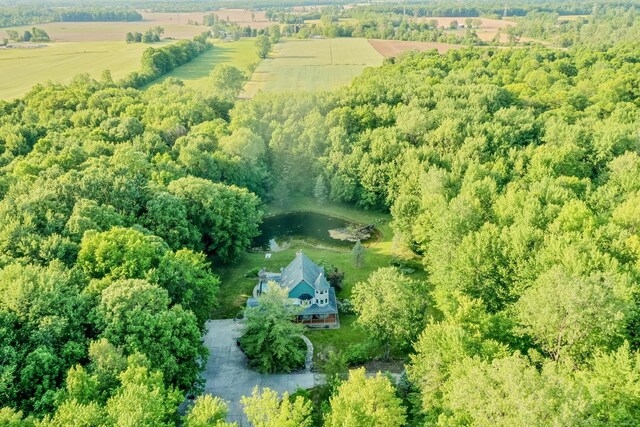 birds eye view of property with a rural view