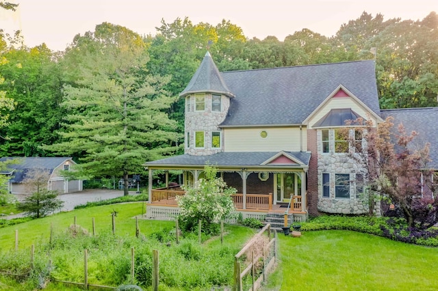 view of front of property with a front yard and a porch