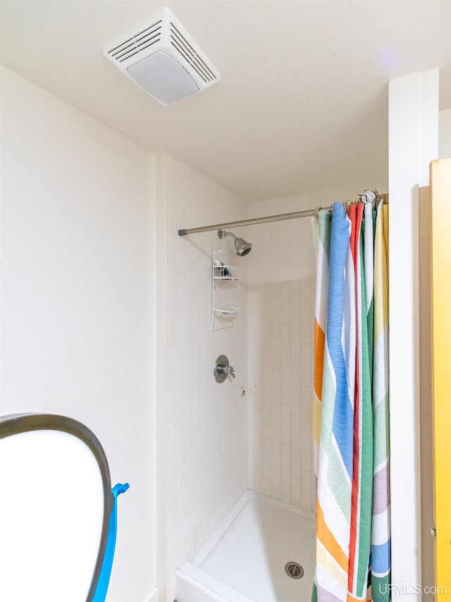 bathroom featuring walk in shower