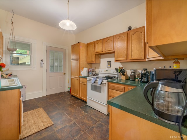 kitchen featuring white electric range oven and decorative light fixtures