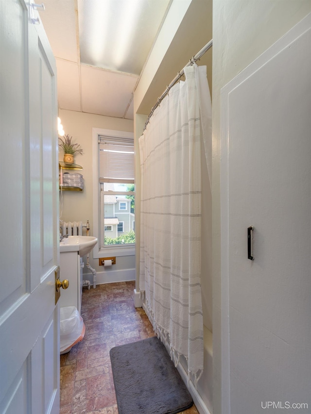 bathroom with vanity and shower / tub combo