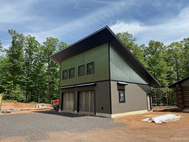 view of side of property with a garage