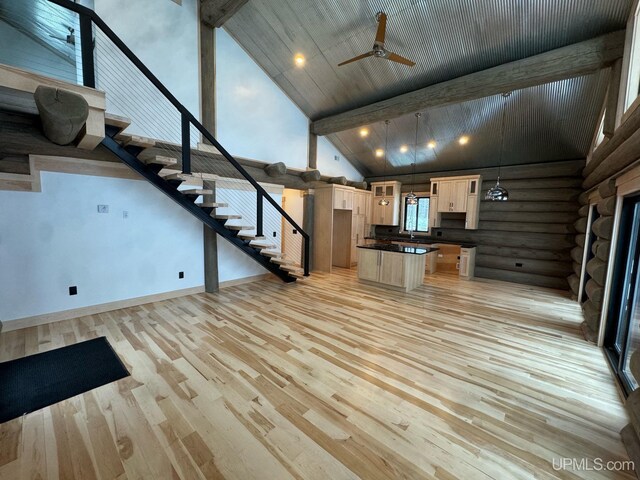 kitchen with sink, a center island, stainless steel appliances, and dark hardwood / wood-style floors