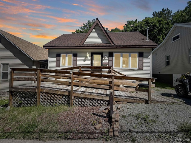 view of front of property with a wooden deck