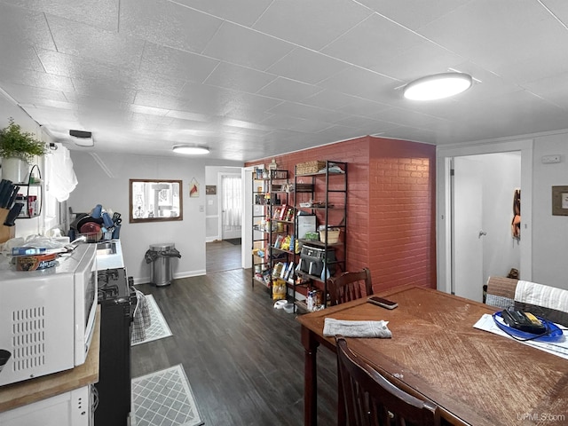 dining area with dark wood-type flooring