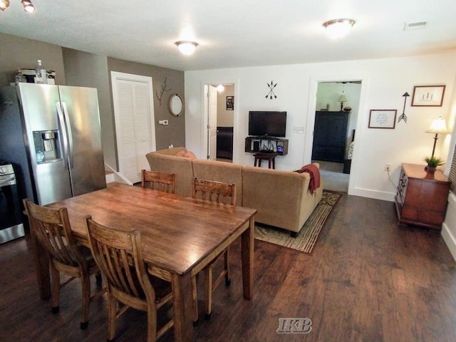 dining space with dark wood-type flooring