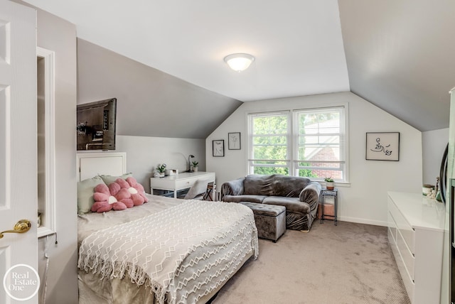 carpeted bedroom with lofted ceiling