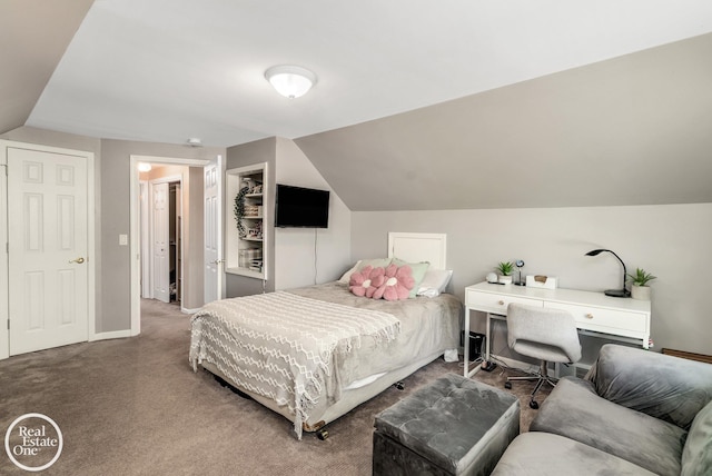 carpeted bedroom with lofted ceiling