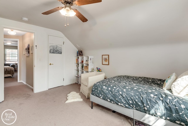 carpeted bedroom featuring ceiling fan and lofted ceiling