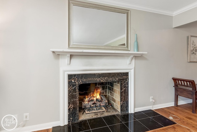 interior details with hardwood / wood-style flooring, a fireplace, and ornamental molding