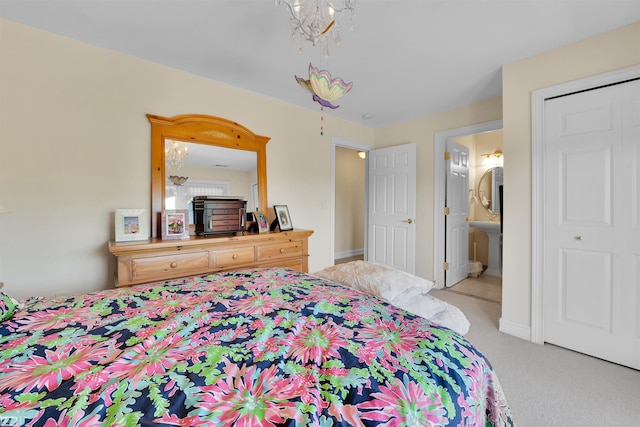 carpeted bedroom with ensuite bath