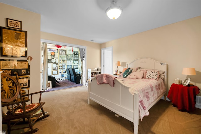 bedroom featuring carpet and access to outside