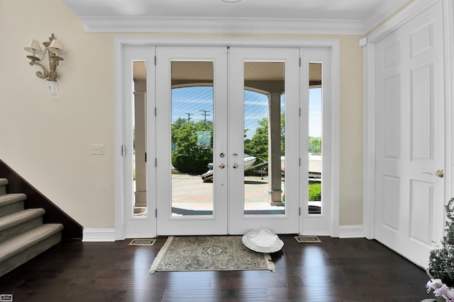 entryway featuring french doors, dark hardwood / wood-style flooring, and crown molding