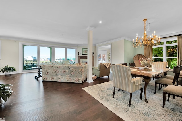 dining room featuring a chandelier, dark hardwood / wood-style floors, and ornamental molding