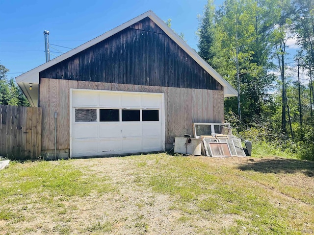 garage featuring a yard