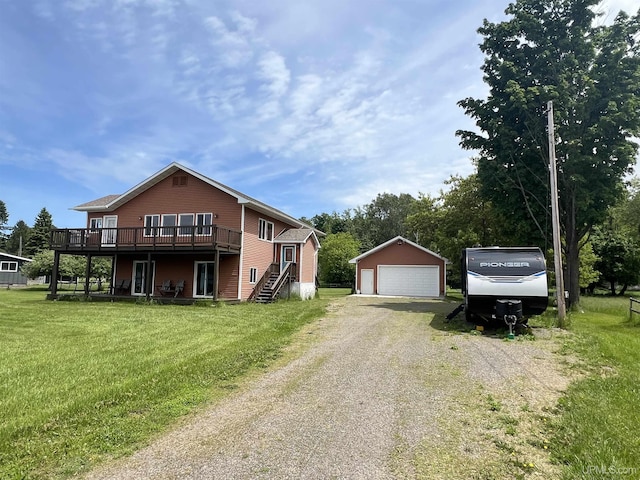 view of property exterior featuring a garage, a wooden deck, a yard, and an outbuilding