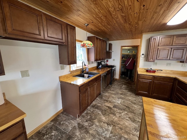 kitchen featuring hanging light fixtures, sink, wood ceiling, and stainless steel appliances