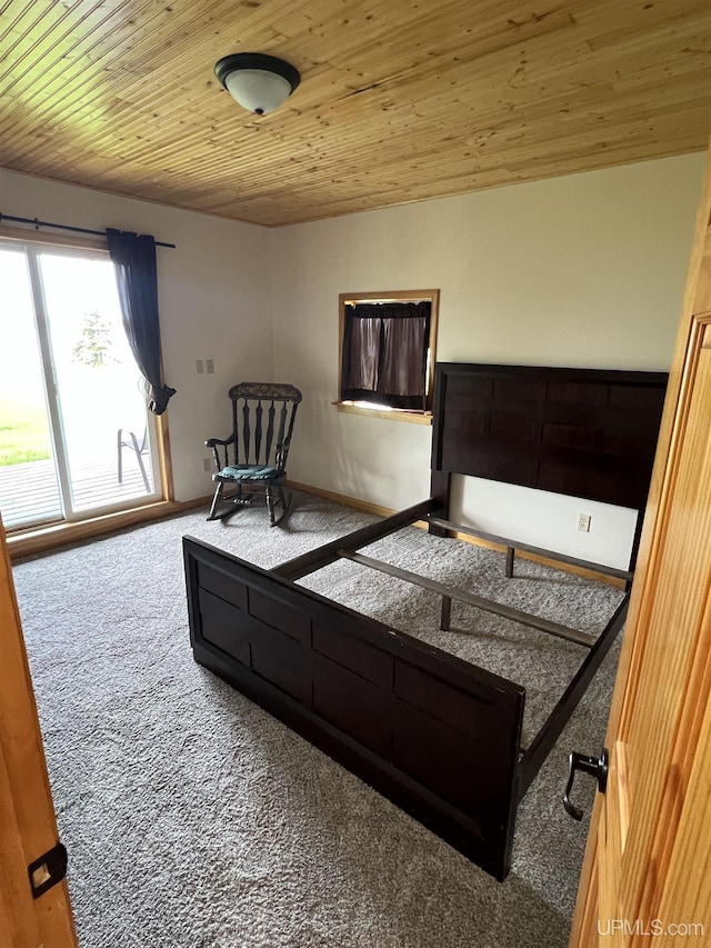 carpeted bedroom with wood ceiling and access to outside