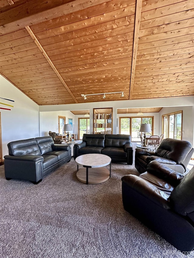 carpeted living room with beamed ceiling, high vaulted ceiling, and wood ceiling