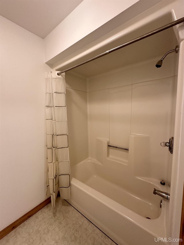 bathroom featuring shower / bath combo with shower curtain