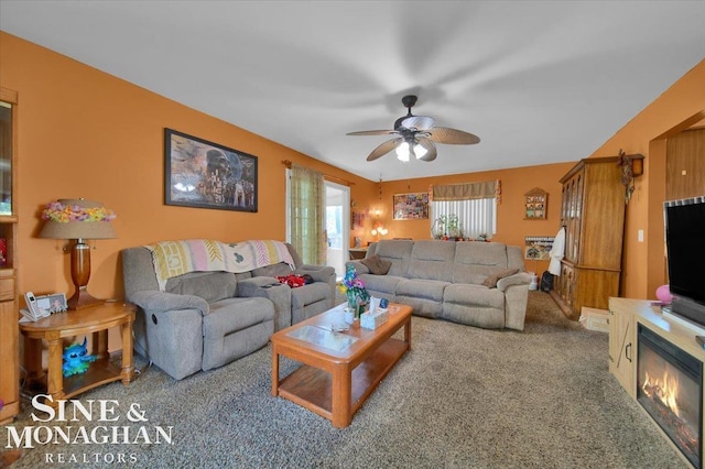 living room featuring ceiling fan and carpet