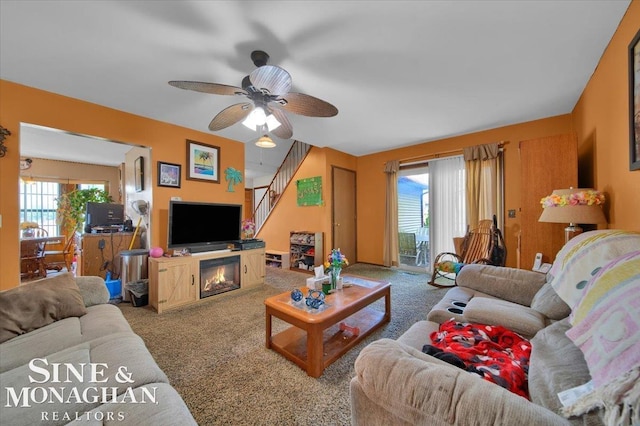 living room with carpet and ceiling fan