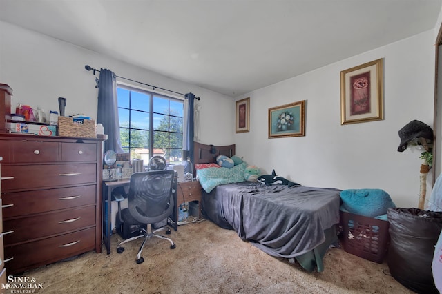 bedroom featuring light colored carpet