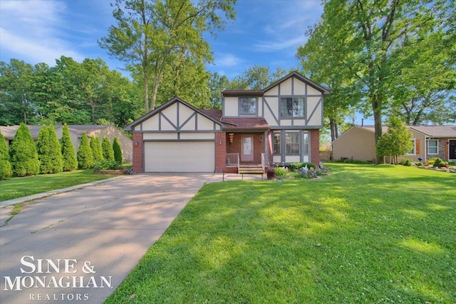 english style home with a garage and a front lawn