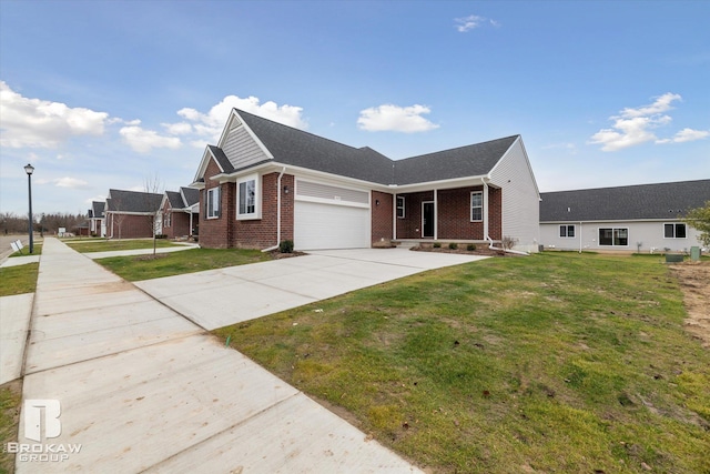 view of front of property with a front lawn and a garage