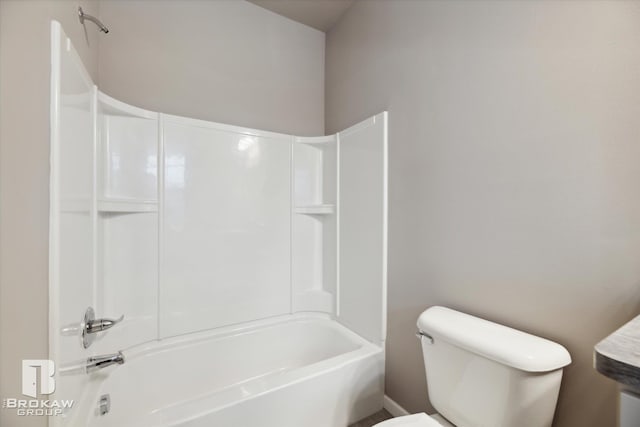 bathroom with toilet and tub / shower combination