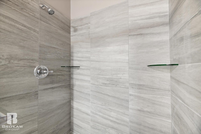 bathroom with a tile shower