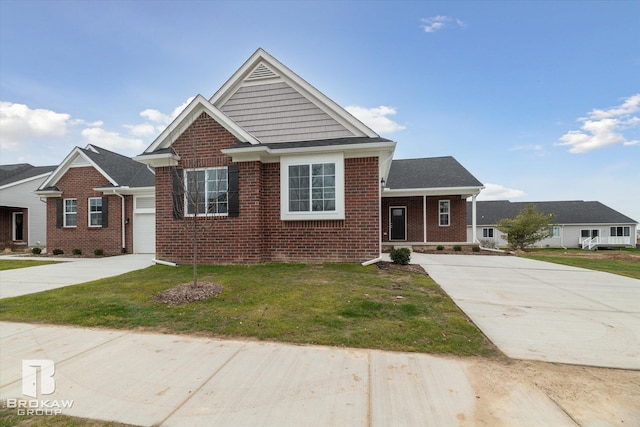 view of front facade with a front yard and a garage