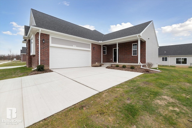 ranch-style home featuring covered porch, a front yard, and a garage