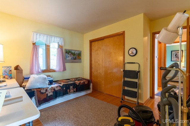 bedroom featuring a closet and light hardwood / wood-style flooring