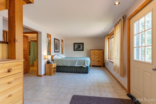 bedroom featuring light tile patterned floors