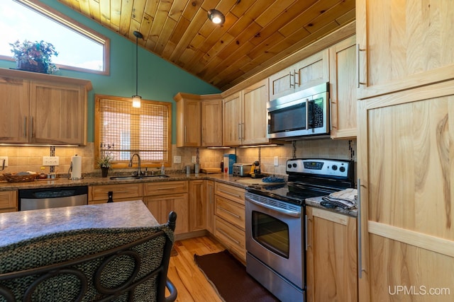 kitchen featuring wooden ceiling, vaulted ceiling, stainless steel appliances, sink, and decorative light fixtures