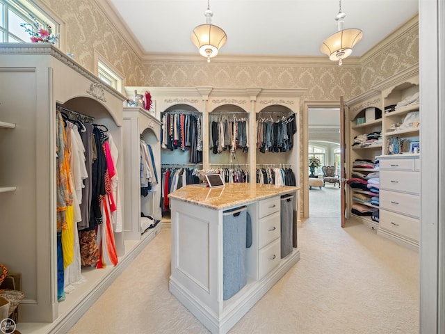 walk in closet featuring light carpet