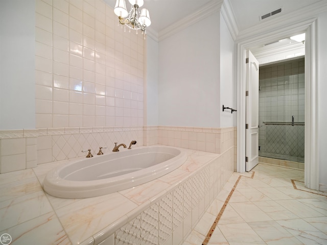 bathroom featuring ornamental molding, a chandelier, a relaxing tiled tub, and tile walls