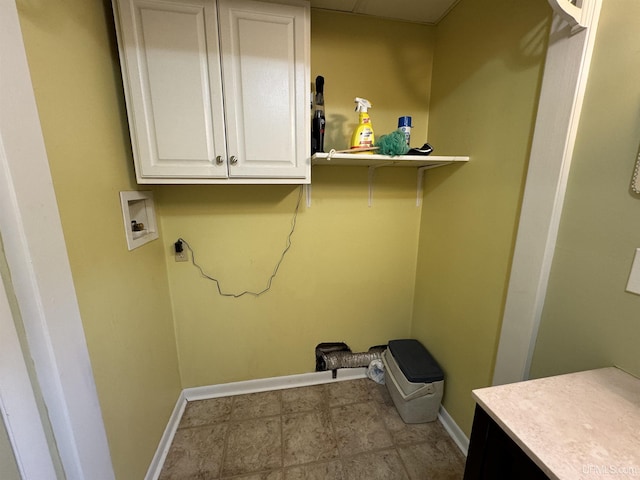 clothes washing area with cabinets, washer hookup, and hookup for an electric dryer