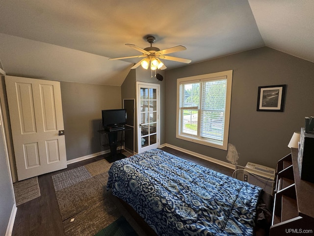 bedroom with ceiling fan, dark hardwood / wood-style flooring, and vaulted ceiling