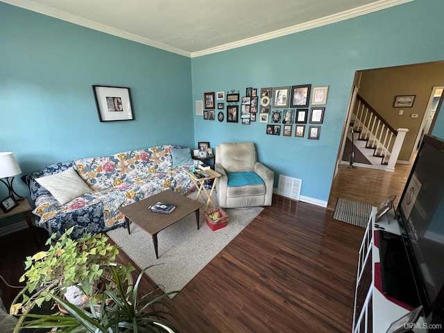 living room with dark hardwood / wood-style floors and ornamental molding