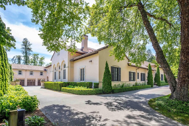 view of property exterior featuring a garage