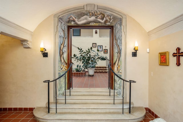 interior space with tile patterned floors and vaulted ceiling