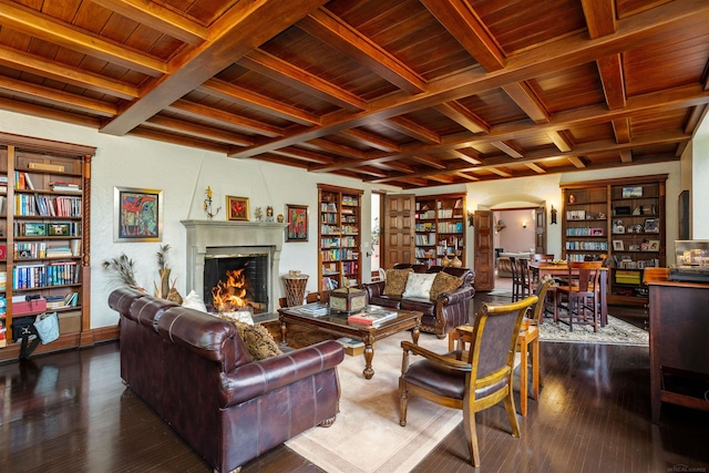 living room with beam ceiling, dark hardwood / wood-style flooring, and wood ceiling