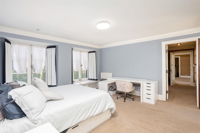 bedroom with crown molding and light colored carpet