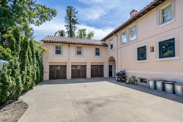 mediterranean / spanish-style home featuring a garage