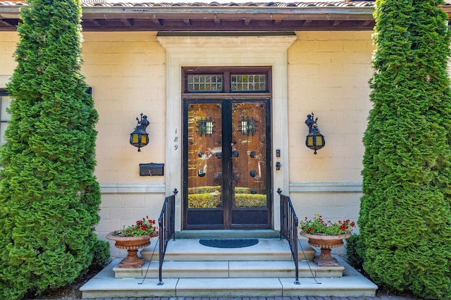 property entrance featuring french doors