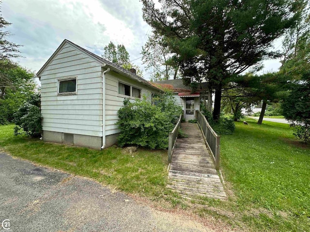 view of home's exterior featuring a yard