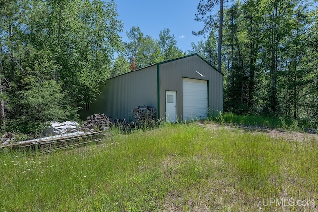 view of outbuilding with a garage