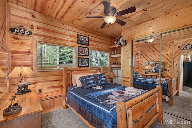 bedroom featuring ceiling fan, wooden ceiling, wood walls, a closet, and carpet